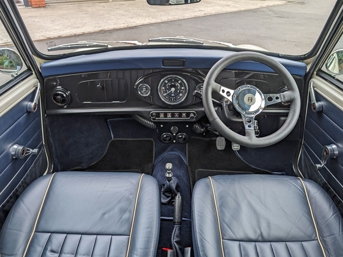 Classic Mini EV fitted with Moto-Lita Steering wheel, Quick Release Boss and a stunning Black 3 Clock Dash. 