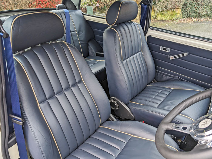 Refurbished Blue Leather Mini Seats, with Cream Piping. 